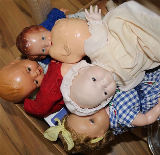 A collection of various Rosebud, Pedigree, Tudor Rose and other dolls, vintage dolls hospital items and two toy pandas